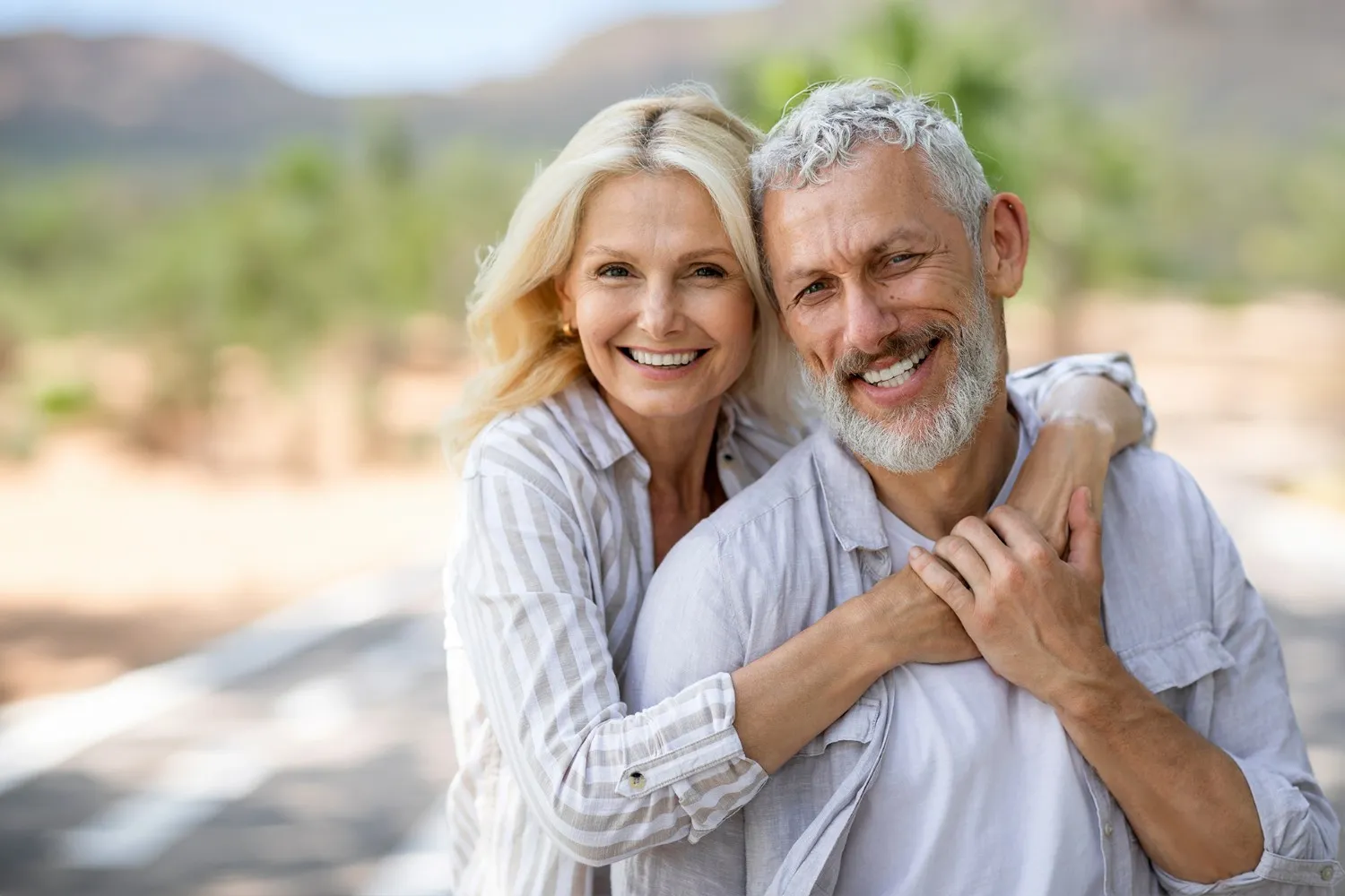 Happy couple smiling after dental implant treatment in Kathmandu
