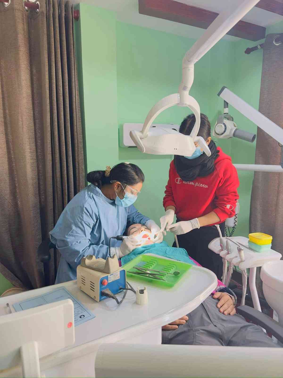 Dentist performing dental treatment on patient at Agrim Dental Clinic Kathmandu